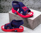 Navy blue and red ChuChuMusical Fancy sandals for babies, featuring whistle sound and supportive rubber soles